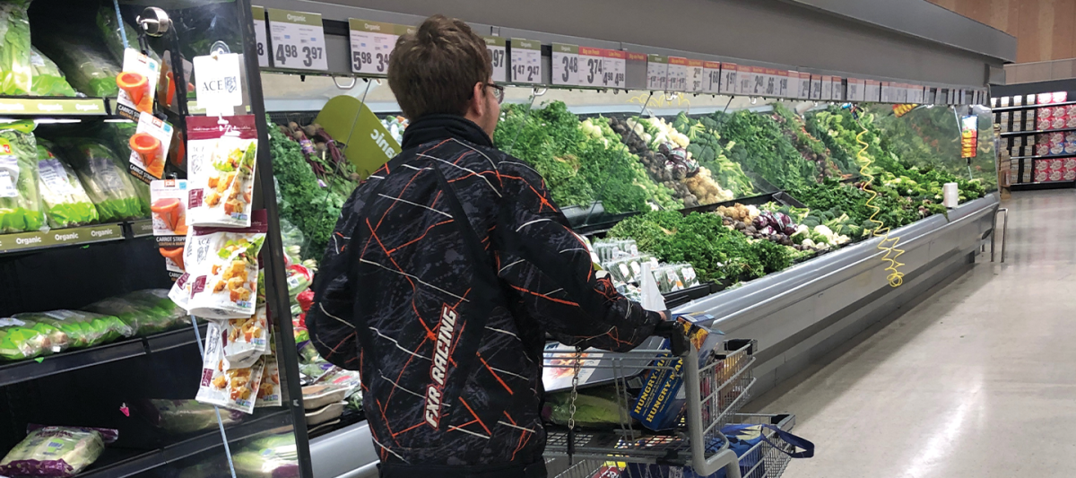 Young man in a grocery store
