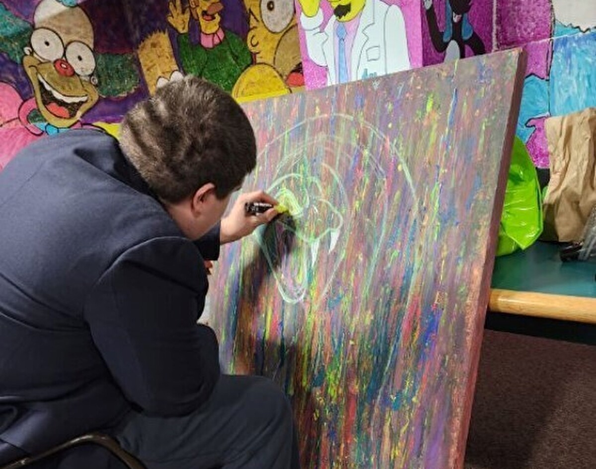 Man sitting and paining