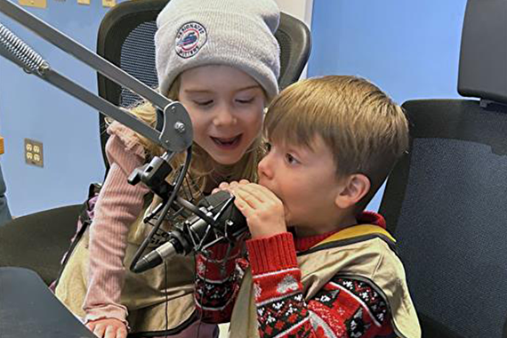 Two EELC youth talking on a radio mic
