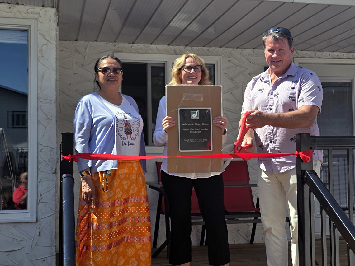 Ribbon cutting with elder, Greg, Natalie