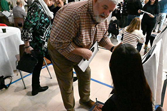 Youth signing their art calendar