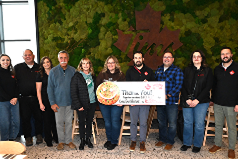 Owners and ESV staff with a cheque